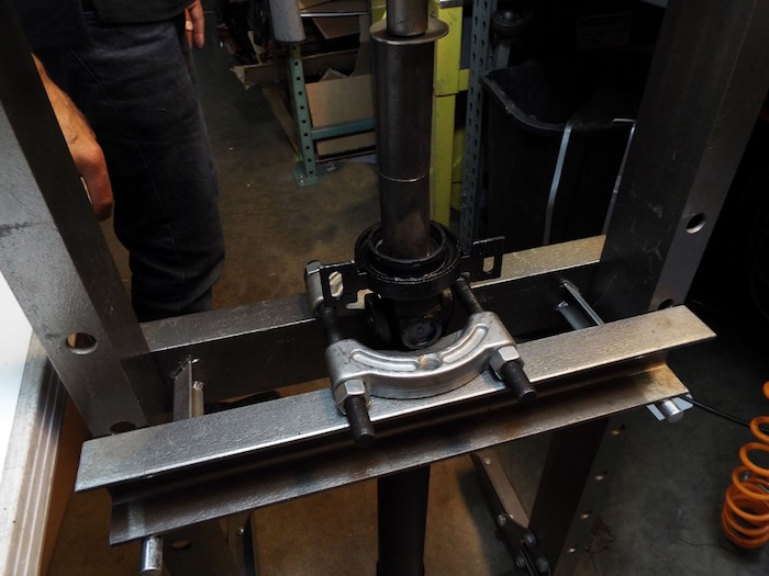 driveshaft is mounted on a press ready to press shaft support