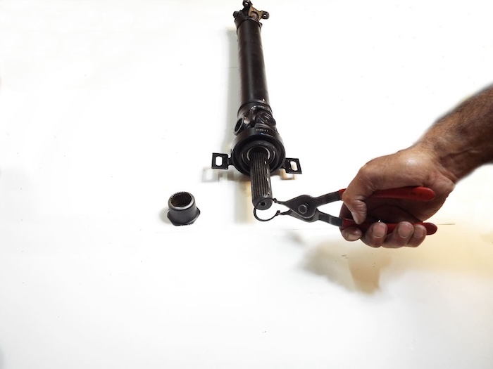 installing the snap ring and locking nut on the driveshaft